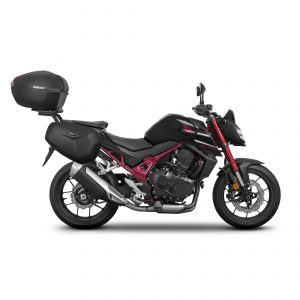 Fissaggi per montare una valigia superiore alla moto. Compatibile con piastre di montaggio piccole (D1B29PA), medie (D1B40PA) e grandi (D1B591PA), valide per tutti i bauletti SHAD e SHAD TERRA.